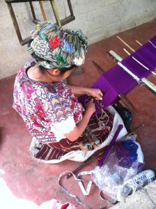 Woman making a wallet in Chajul